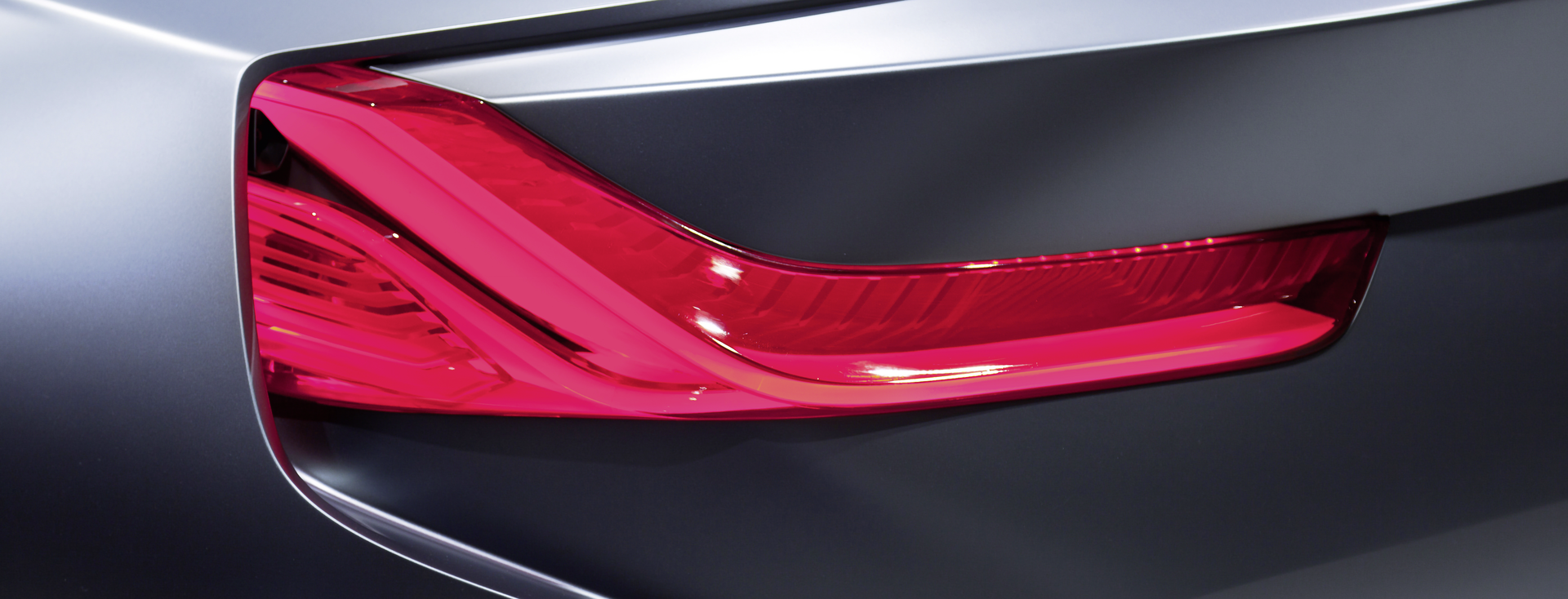 close-up of the red bumper light of a dark gray car